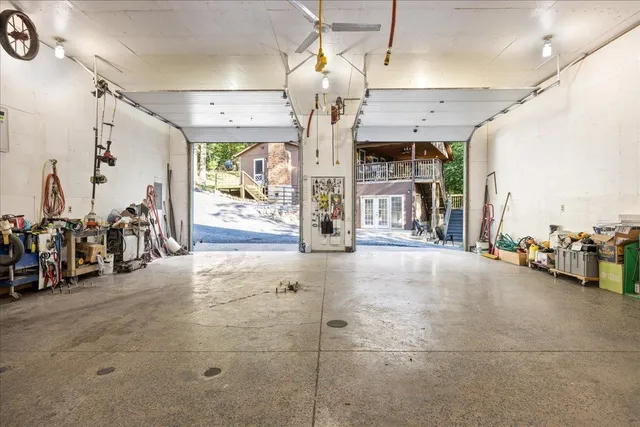 an aerial view of a house with yard and outdoor seating