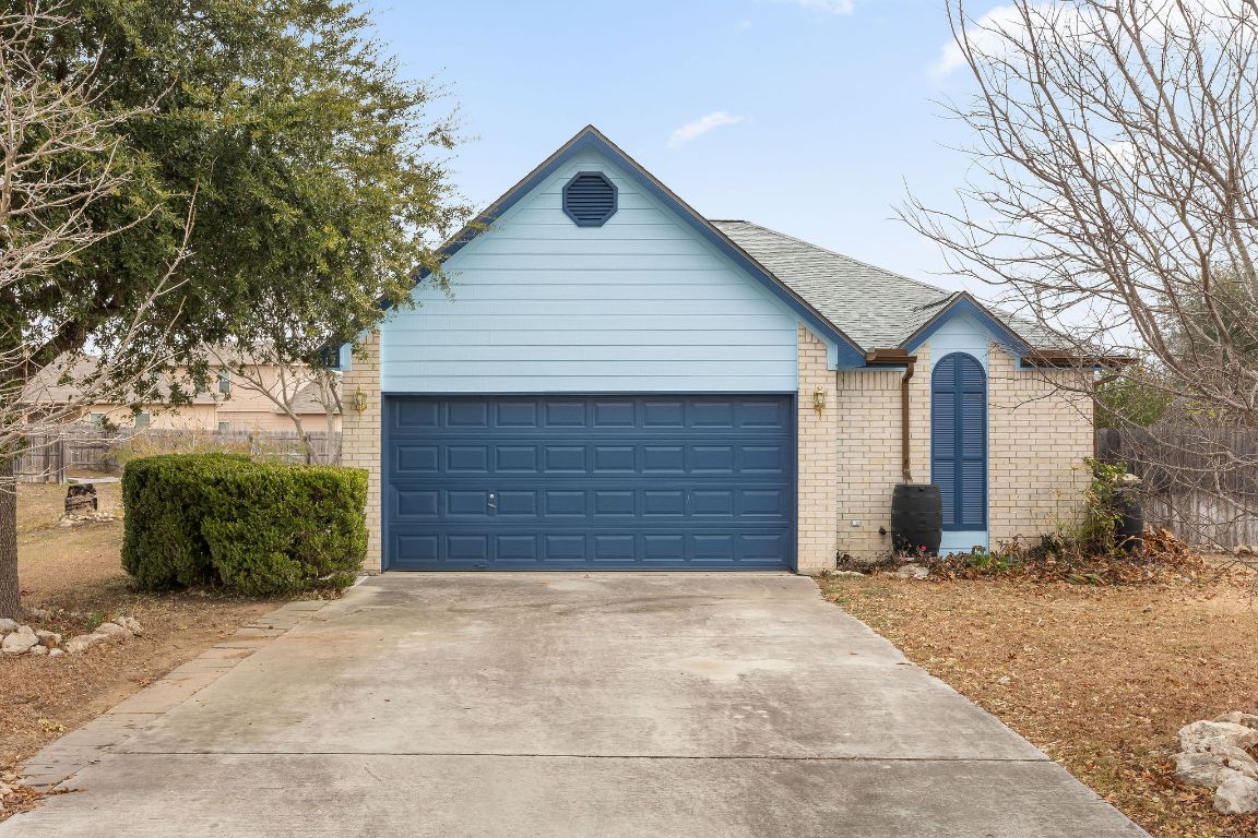 a front view of house with a yard and garage