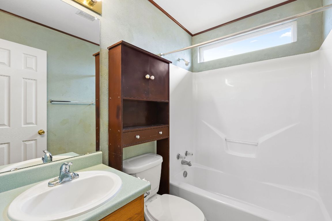 112 Amherst Court Kyle, TX 78640 - Photo 23 of 38 a bathroom with a sink toilet and shower