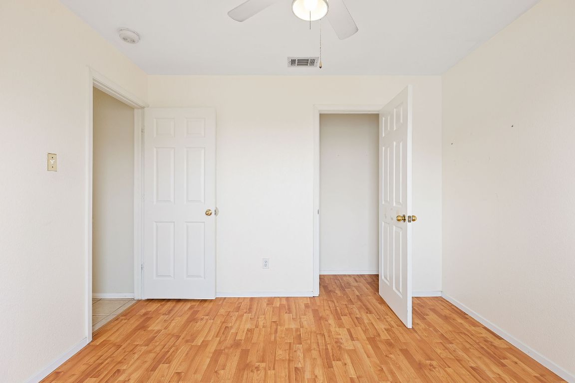 112 Amherst Court Kyle, TX 78640 - Photo 28 of 38 a view of a room with wooden floor