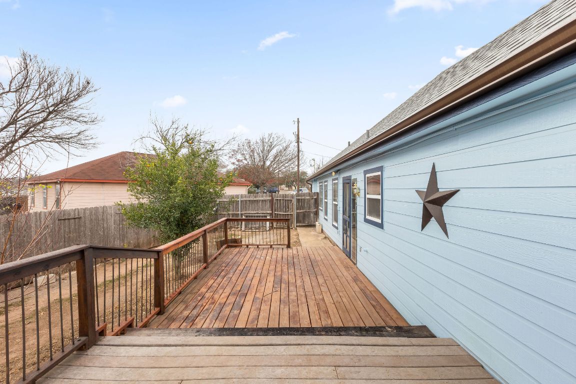 112 Amherst Court Kyle, TX 78640 - Photo 34 of 38 a view of balcony with wooden floor and outdoor seating