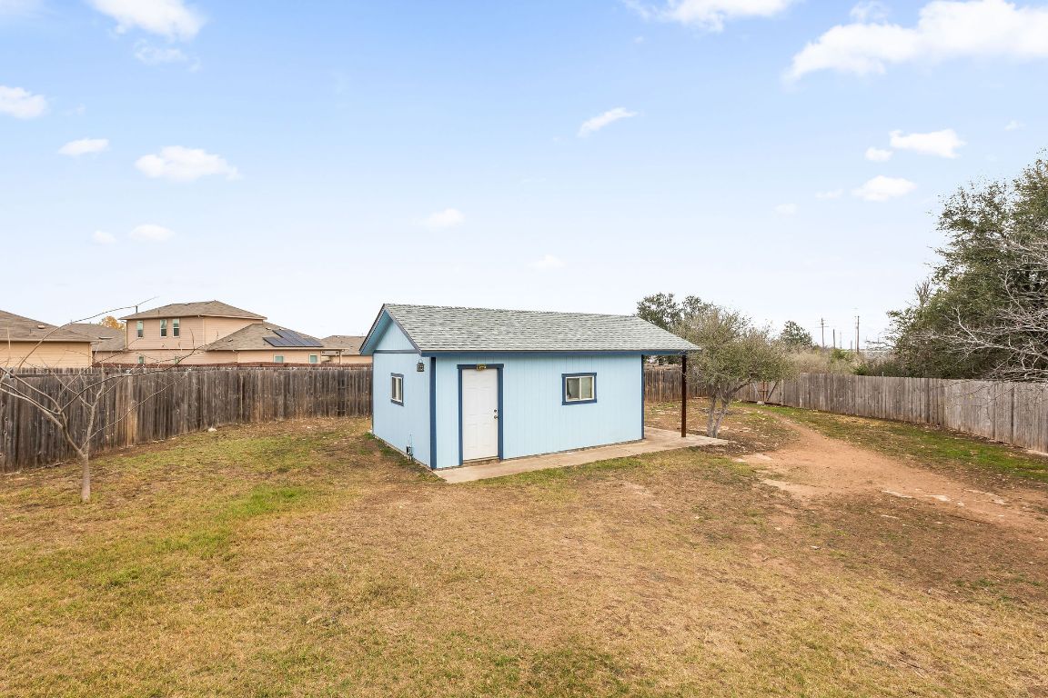 112 Amherst Court Kyle, TX 78640 - Photo 35 of 38 a view of a house with a yard and mountain view