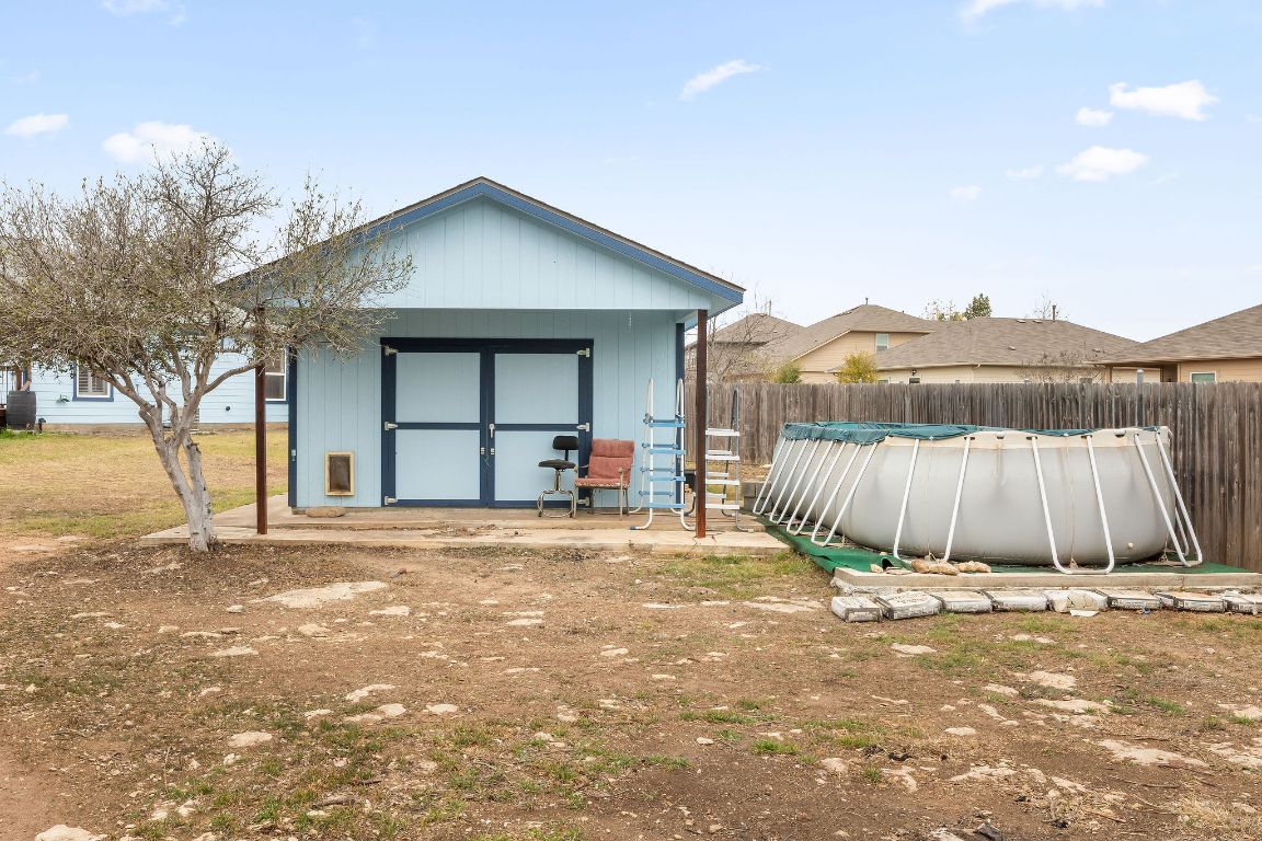 112 Amherst Court Kyle, TX 78640 - Photo 38 of 38 a front view of a house with a yard and garage