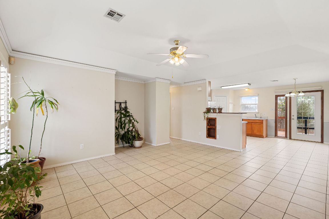 112 Amherst Court Kyle, TX 78640 - Photo 5 of 38 a view of a kitchen with furniture and an entryway