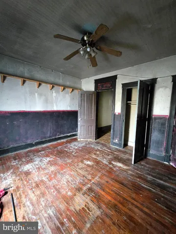 a view of an empty room with a fireplace