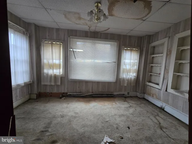 an empty room with windows
