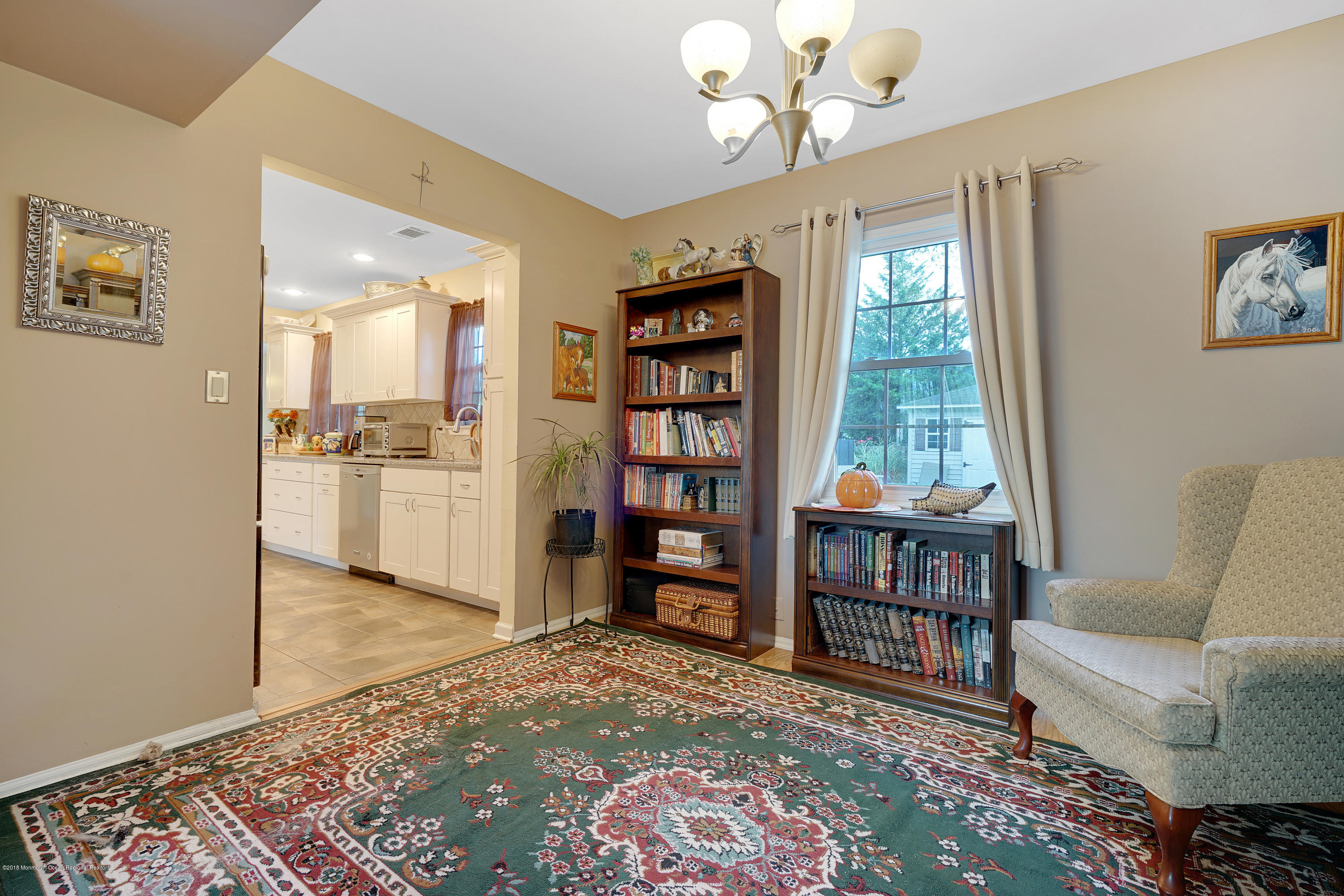 123 Reflection Road Toms River, NJ 08753 - Photo 17 of 41 a living room with furniture and a book shelf