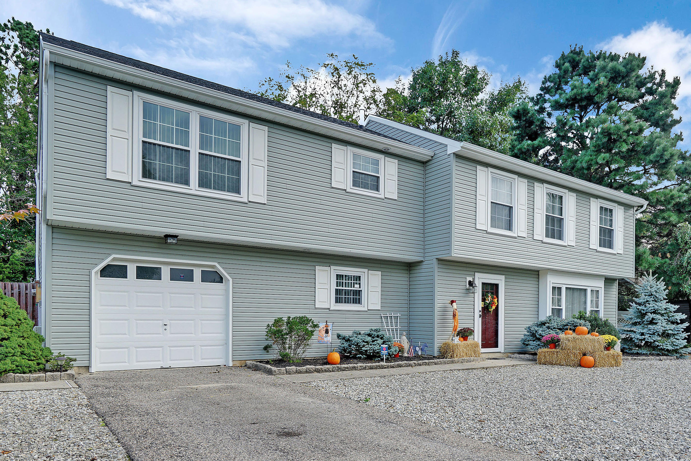 123 Reflection Road Toms River, NJ 08753 - Photo 2 of 41 a front view of a house with the garden