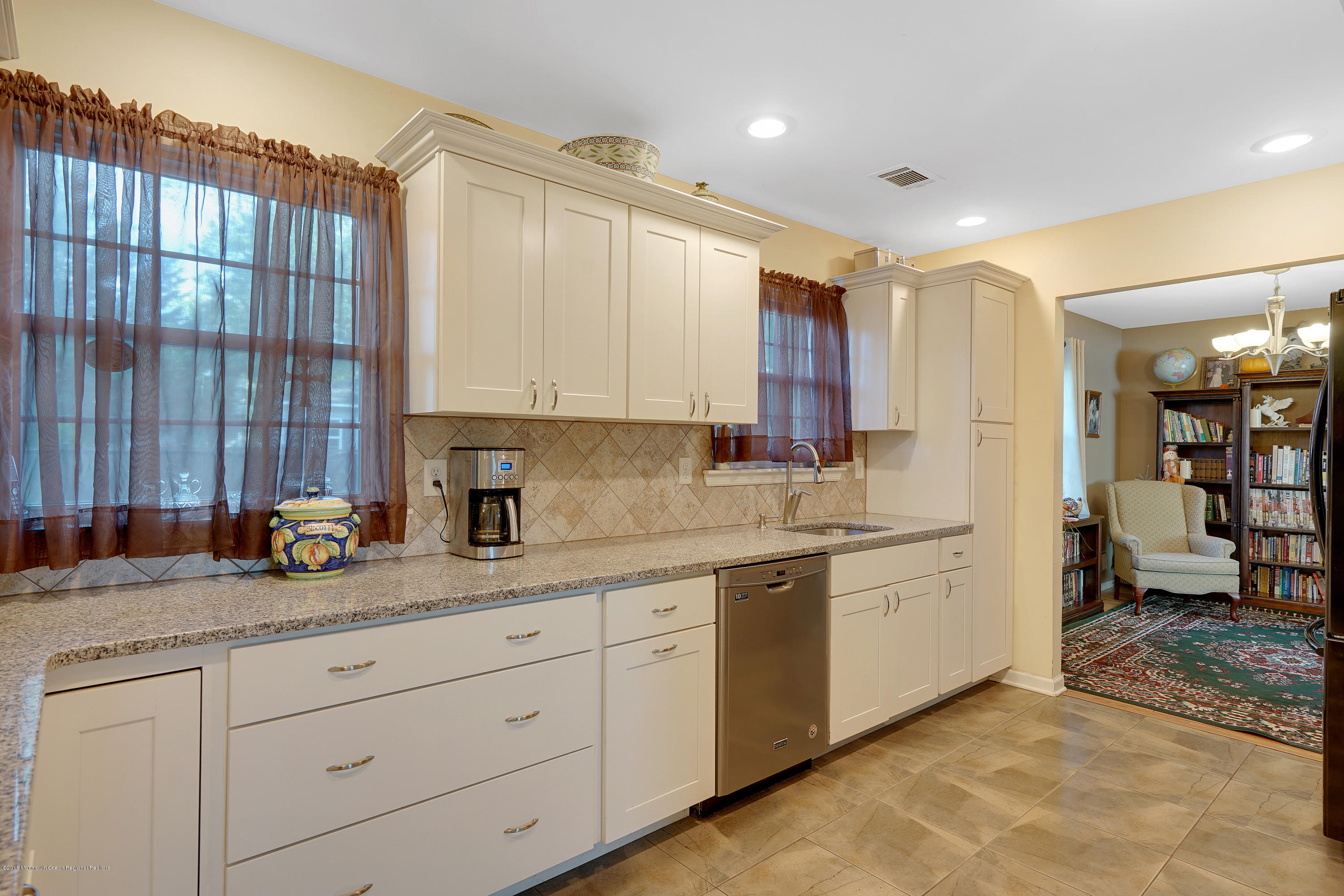 123 Reflection Road Toms River, NJ 08753 - Photo 22 of 41 a kitchen with stainless steel appliances granite countertop a sink stove and cabinets