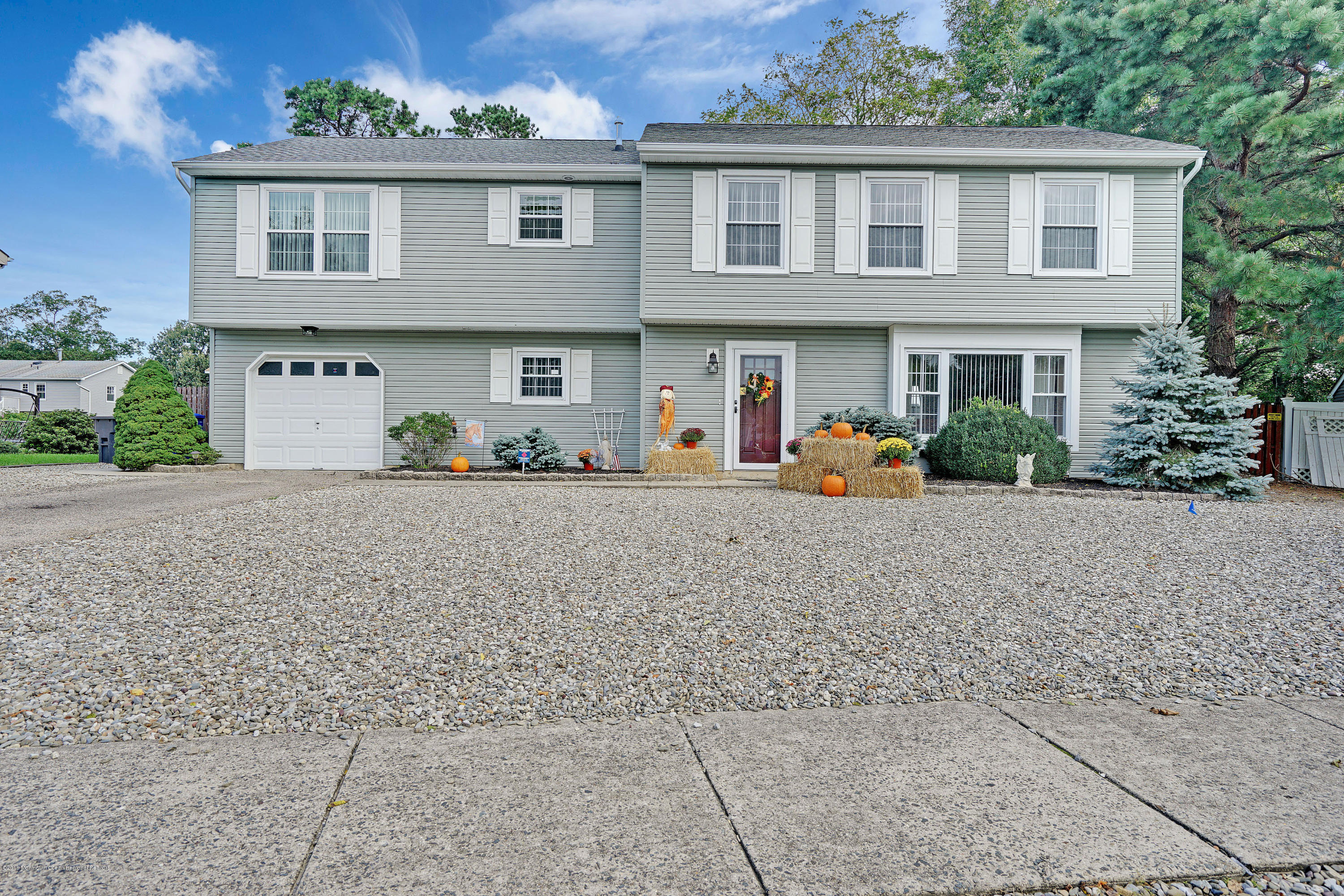 123 Reflection Road Toms River, NJ 08753 - Photo 3 of 41 front view of a house with a street