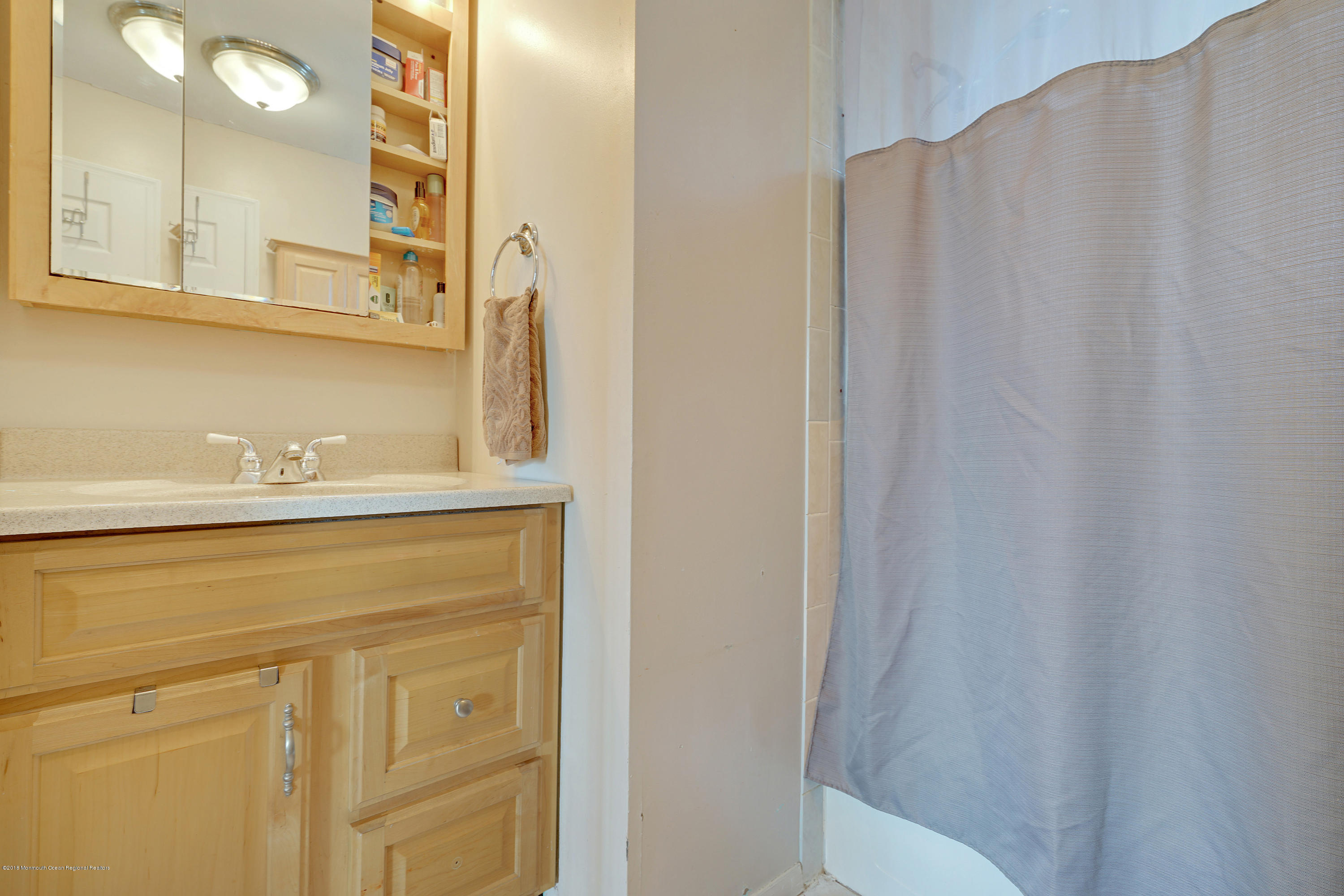 123 Reflection Road Toms River, NJ 08753 - Photo 34 of 41 a bathroom with a sink and a mirror