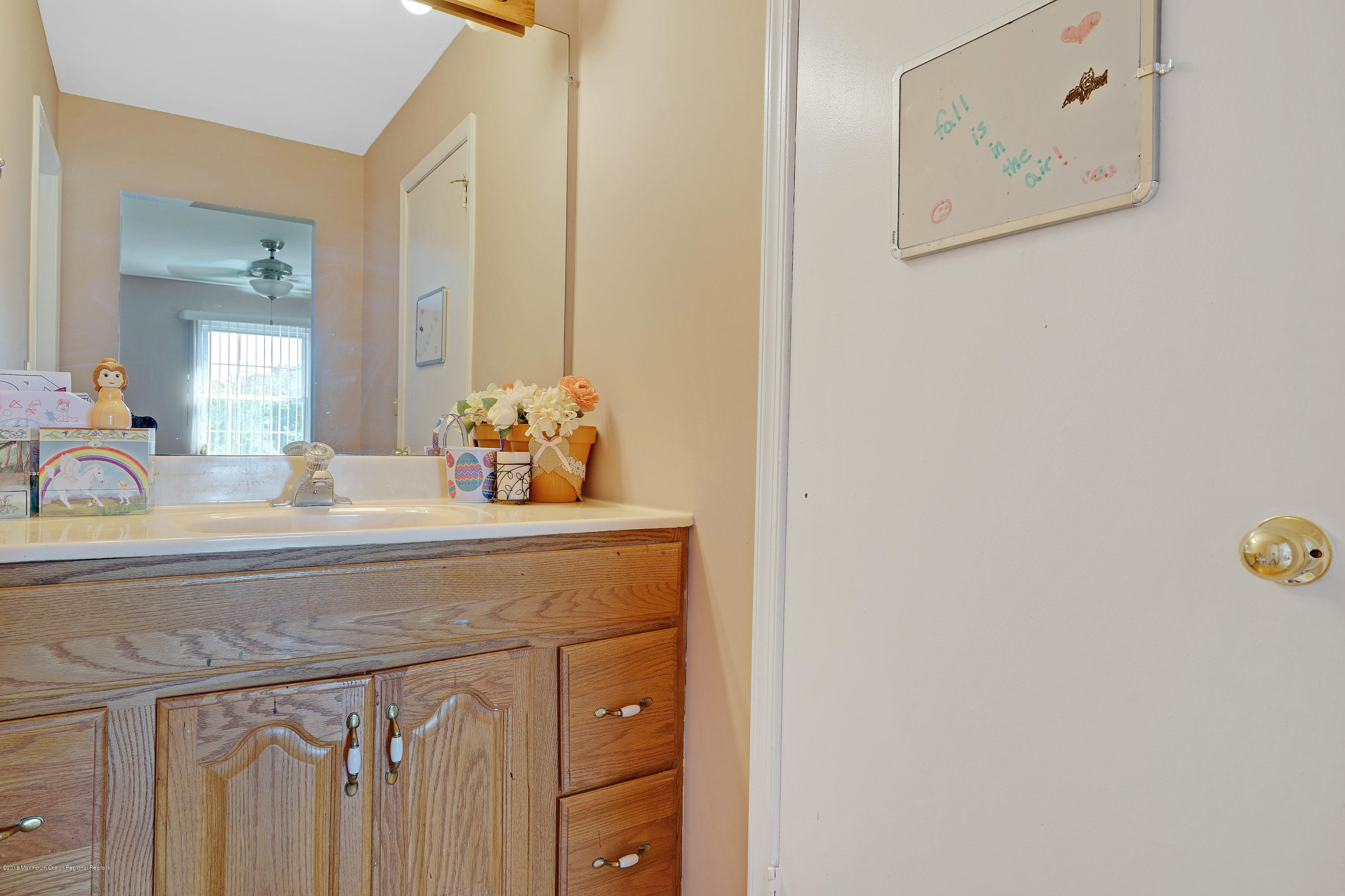 123 Reflection Road Toms River, NJ 08753 - Photo 38 of 41 a bathroom with a sink and a mirror