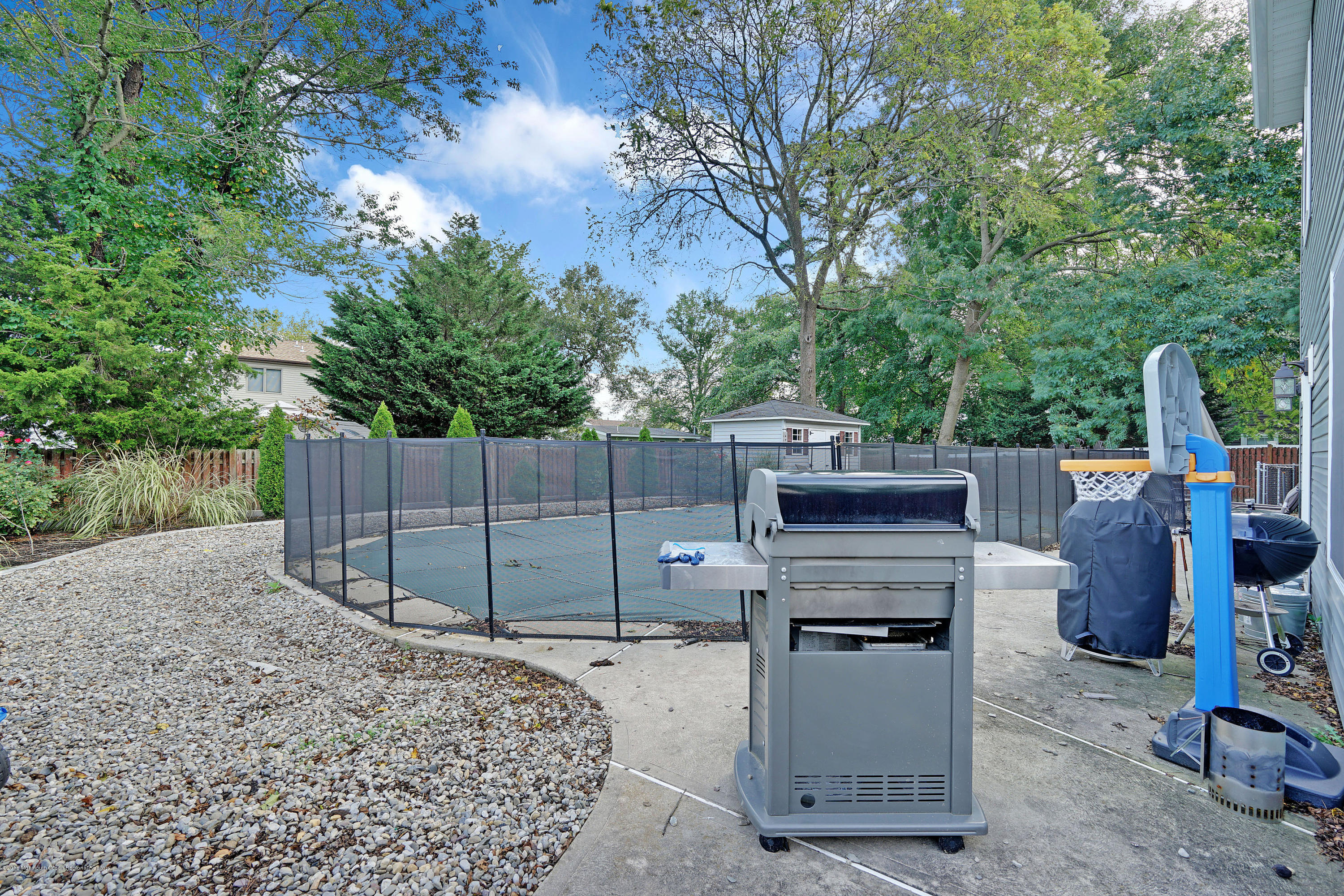 123 Reflection Road Toms River, NJ 08753 - Photo 8 of 41 a view of a backyard with washer and dryer
