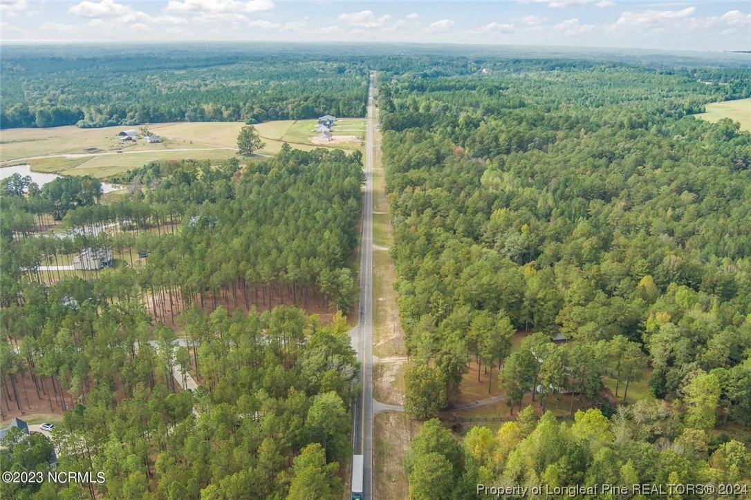 2352 County Line Road Cameron, NC 28326 - Photo 14 of 38 a view of an outdoor space and a yard