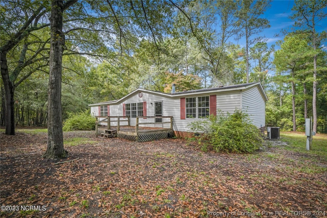 2352 County Line Road Cameron, NC 28326 - Photo 3 of 38 a house with trees in the background