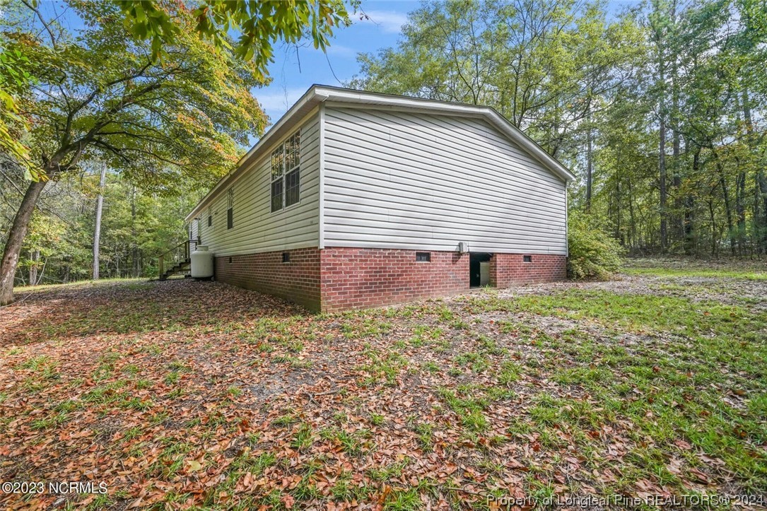2352 County Line Road Cameron, NC 28326 - Photo 5 of 38 a view of a house with a yard