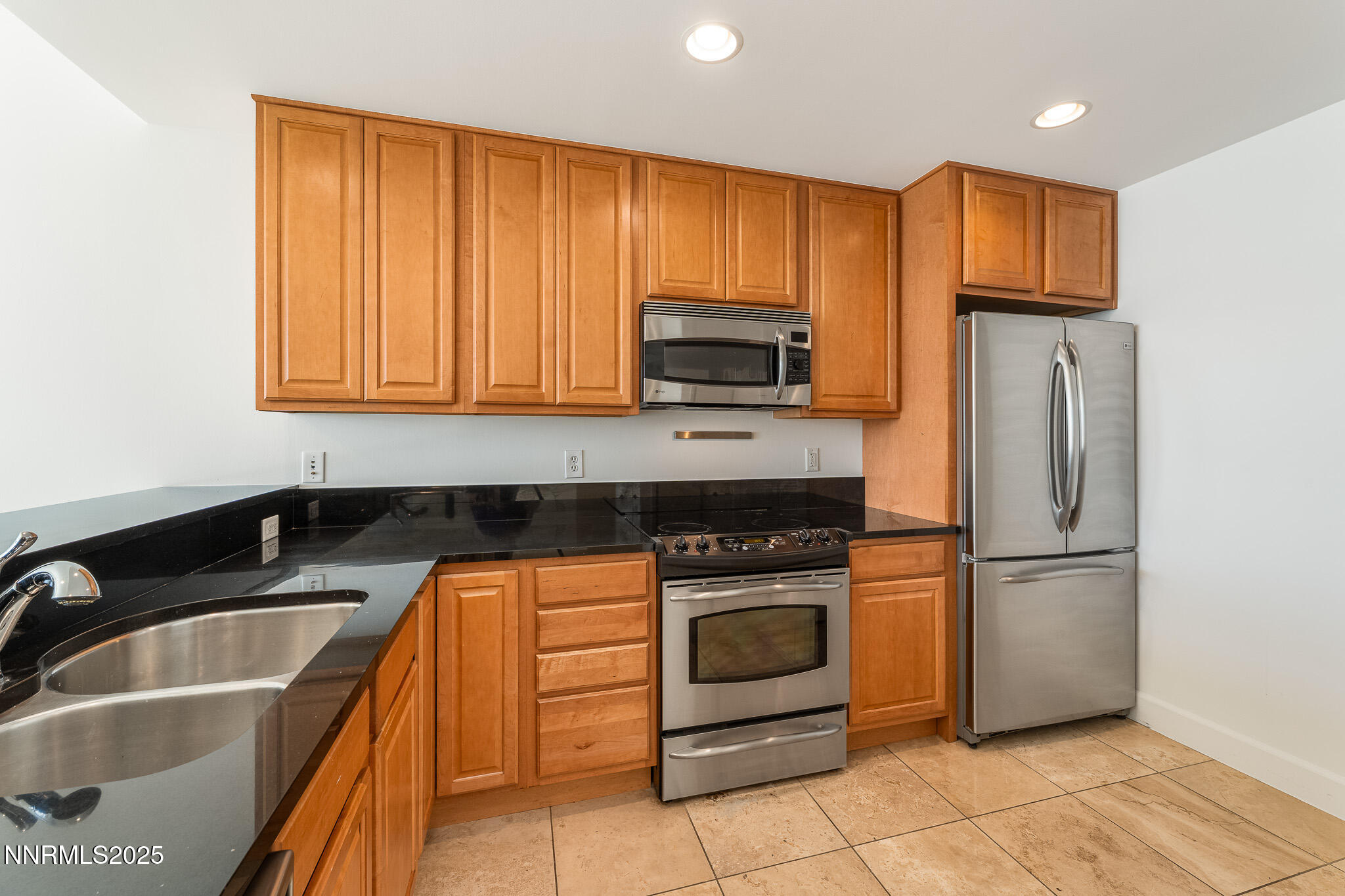 50 North Sierra Street, Unit STE 909 Reno, NV 89501 - Photo 11 of 34 a kitchen with a refrigerator sink and microwave