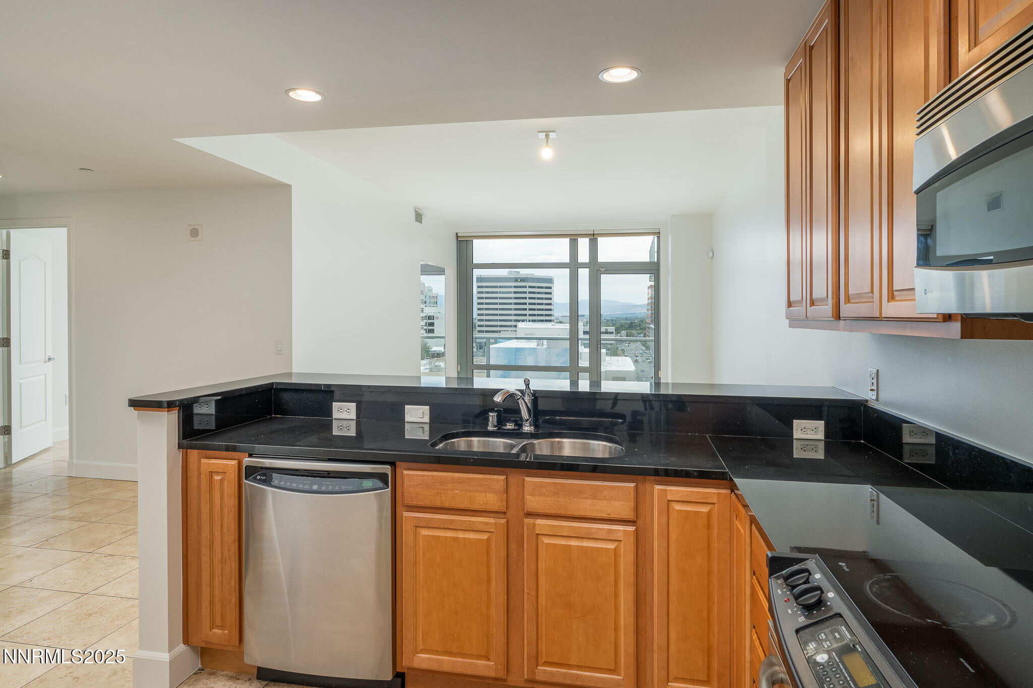 50 North Sierra Street, Unit STE 909 Reno, NV 89501 - Photo 12 of 34 a kitchen with granite countertop a sink and cabinets