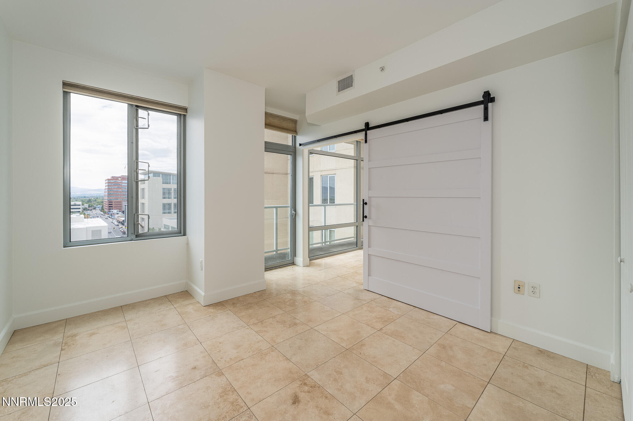 50 North Sierra Street, Unit STE 909 Reno, NV 89501 - Photo 14 of 34 a view of an empty room with a window