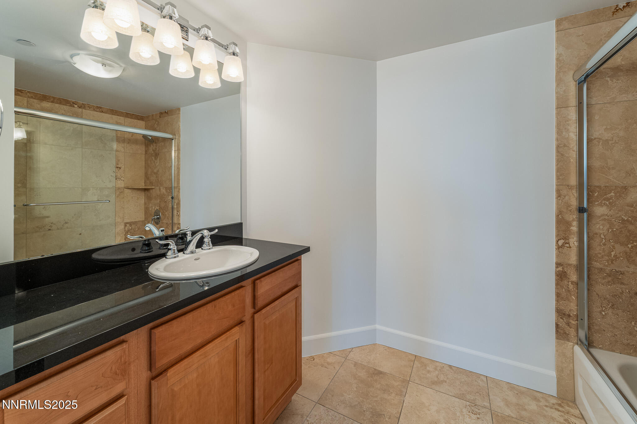 50 North Sierra Street, Unit STE 909 Reno, NV 89501 - Photo 16 of 34 a bathroom with a sink a large mirror and a shower