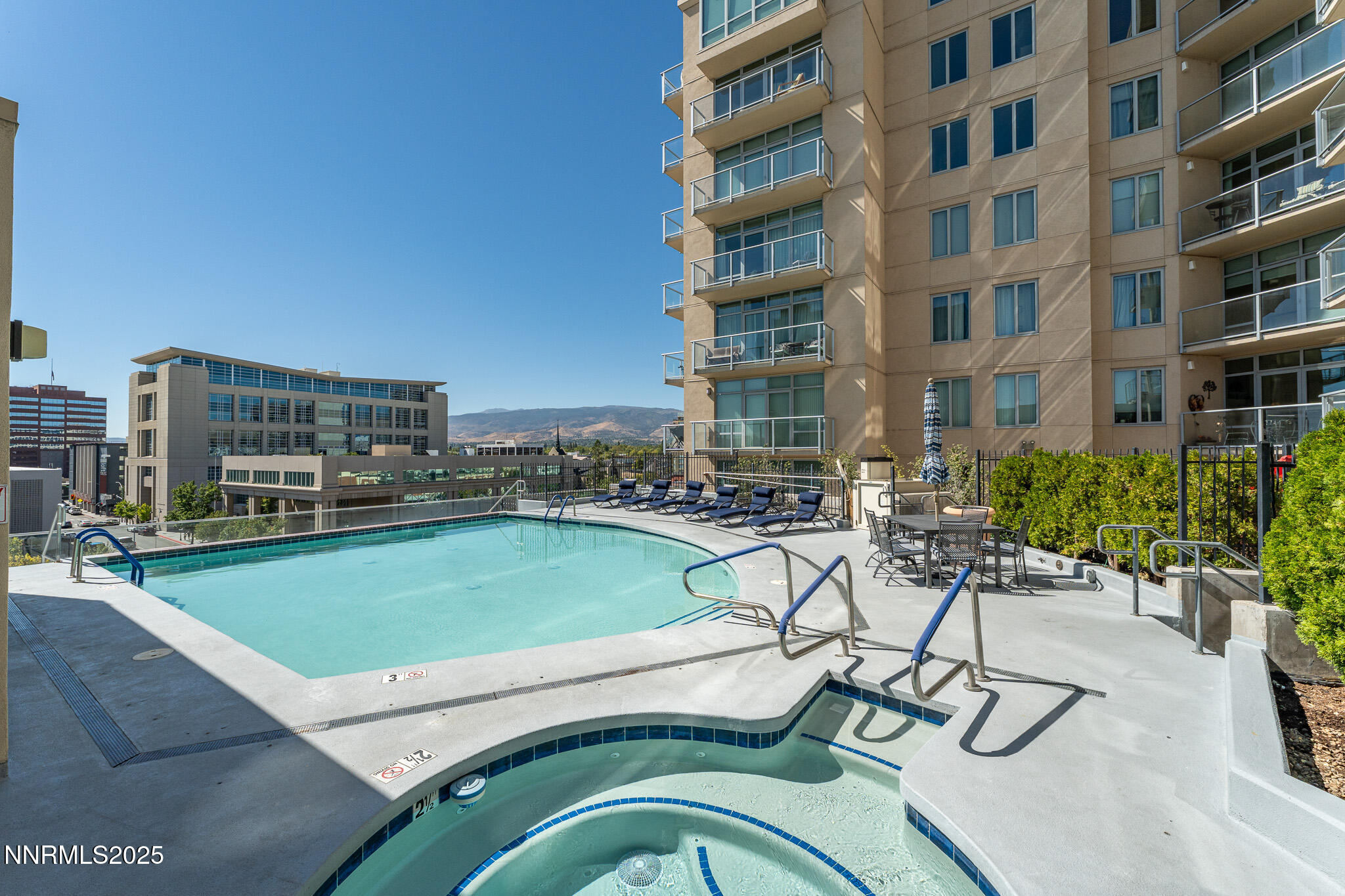 50 North Sierra Street, Unit STE 909 Reno, NV 89501 - Photo 25 of 34 a view of a swimming pool with outdoor seating and plants