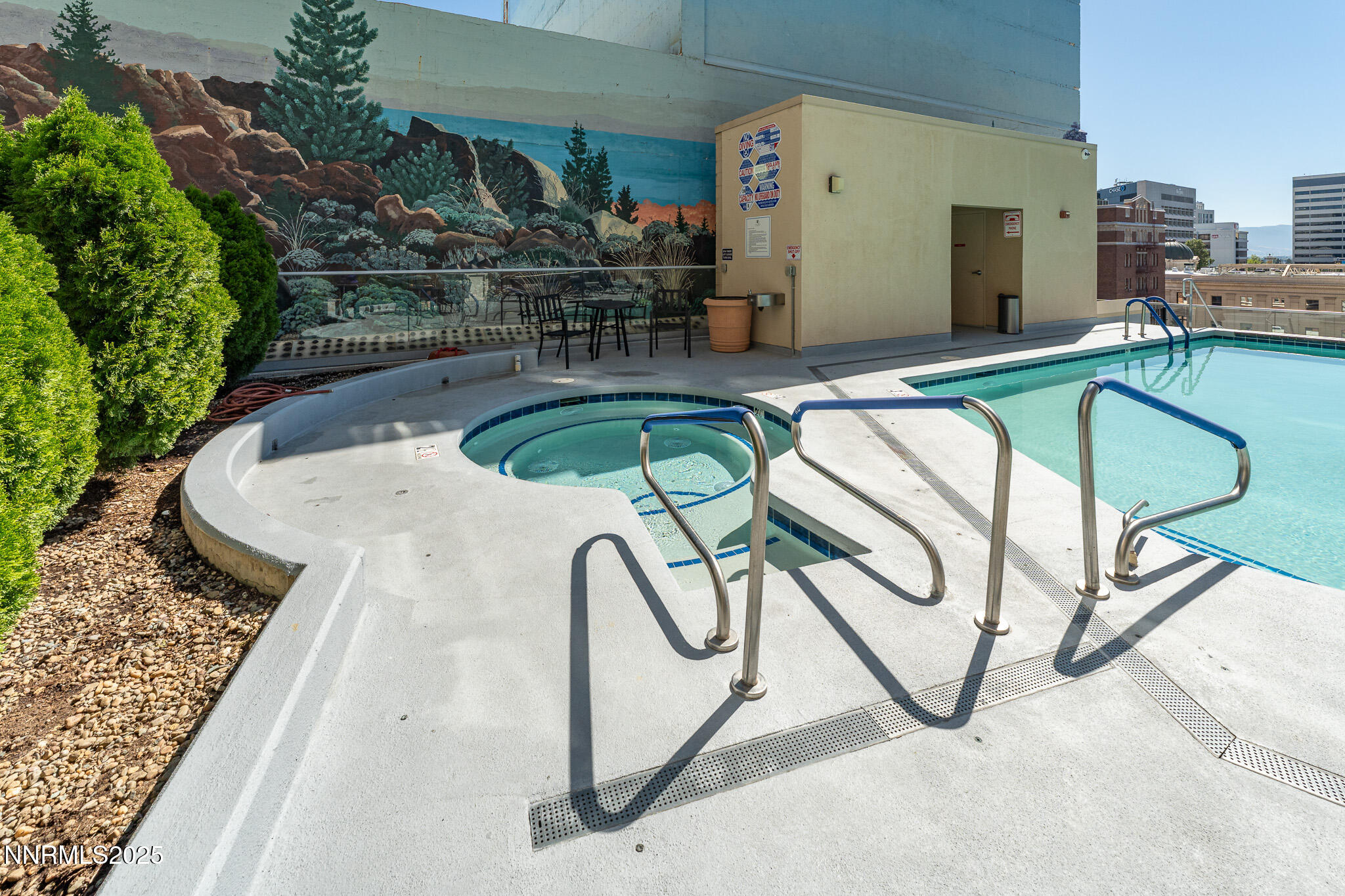 50 North Sierra Street, Unit STE 909 Reno, NV 89501 - Photo 28 of 34 a view of a swimming pool with outdoor seating and plants