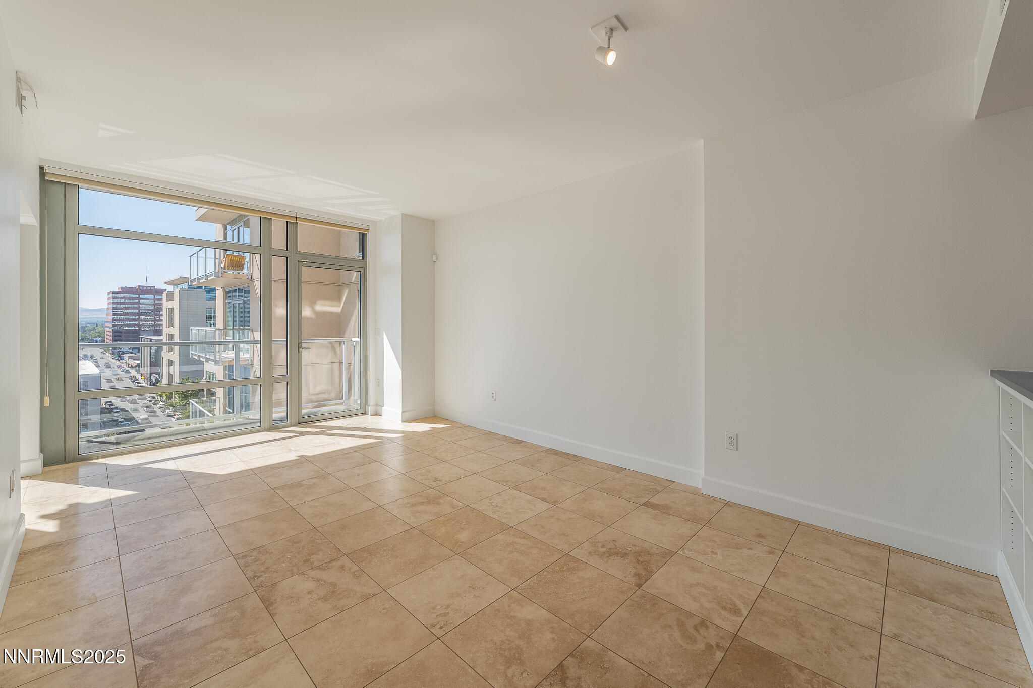 50 North Sierra Street, Unit STE 909 Reno, NV 89501 - Photo 6 of 34 a view of an empty room with a sliding door