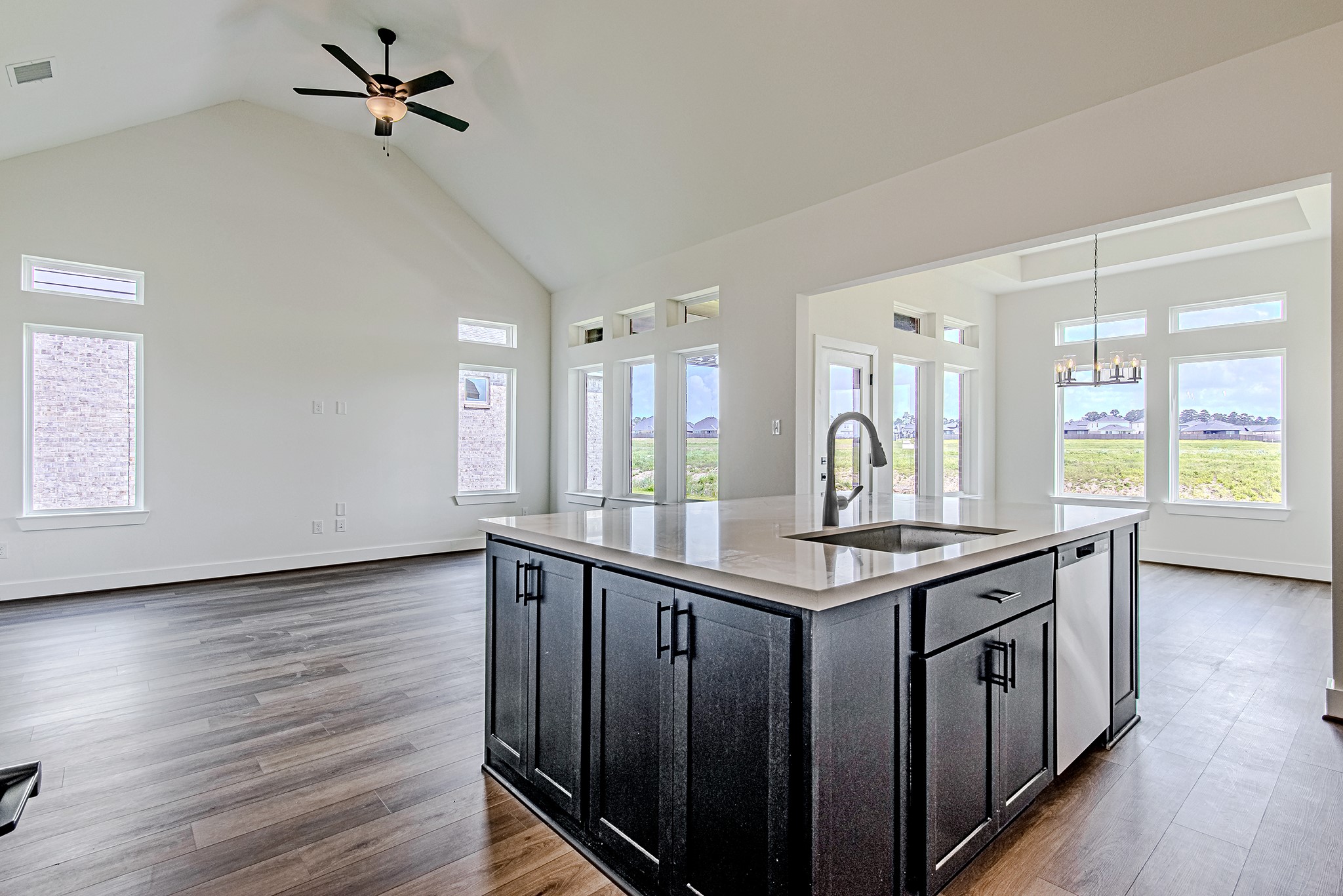 157 Peninsula Point Drive Montgomery, TX 77356 - Photo 8 of 33 a kitchen with granite countertop a stove and wooden floor