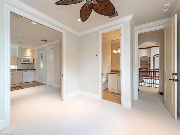 wooden floor and an empty room with a kitchen