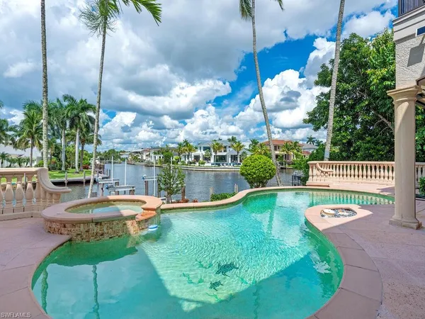 a view of a swimming pool with a patio