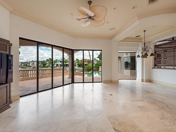 a view of an entryway with floor to ceiling windows