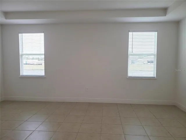a spacious bathroom with a bathtub and a shower