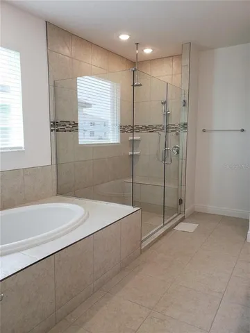 a bathroom with a double vanity sink and mirror