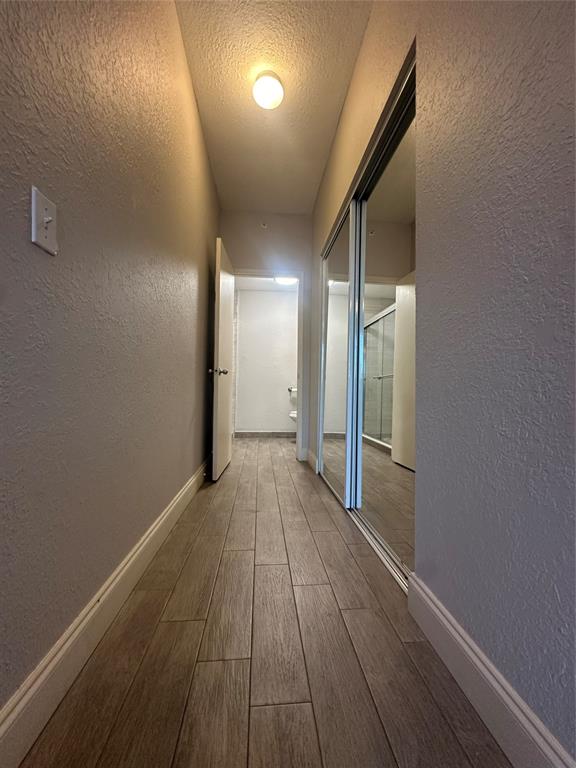 6928 Southwest 39th Street, Unit 207 Fort Lauderdale, FL 33314 - Photo 15 of 21 a view of a hallway with wooden floor