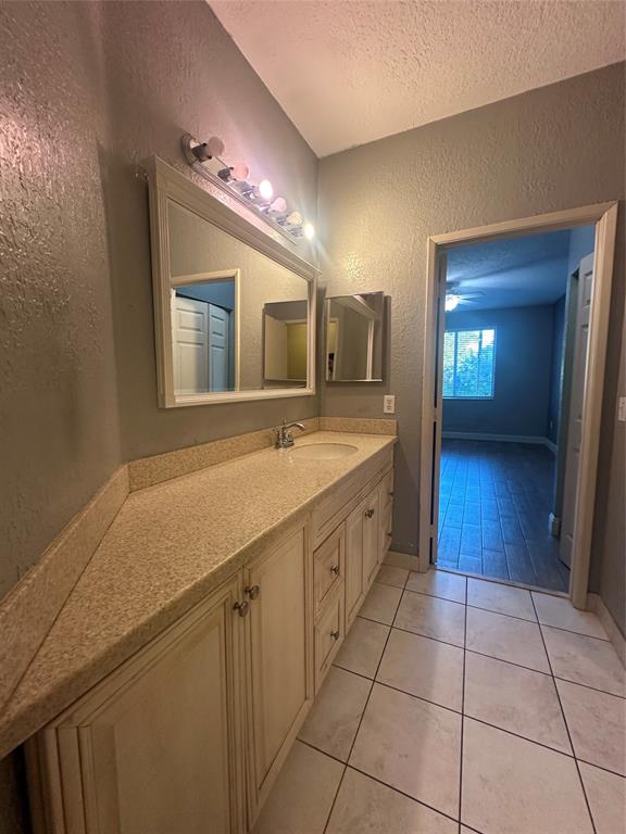 6928 Southwest 39th Street, Unit 207 Fort Lauderdale, FL 33314 - Photo 16 of 21 a spacious bathroom with a sink a mirror and a shower