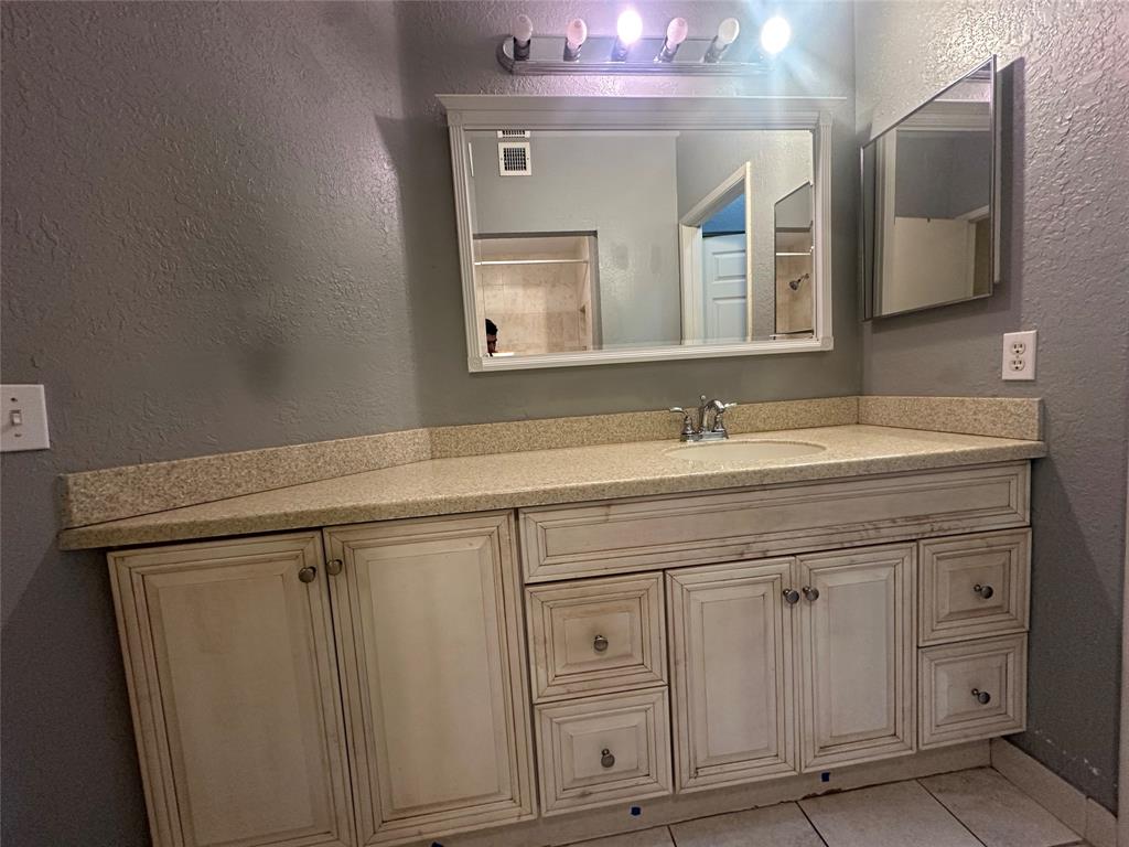 6928 Southwest 39th Street, Unit 207 Fort Lauderdale, FL 33314 - Photo 17 of 21 a bathroom with a sink vanity and mirror