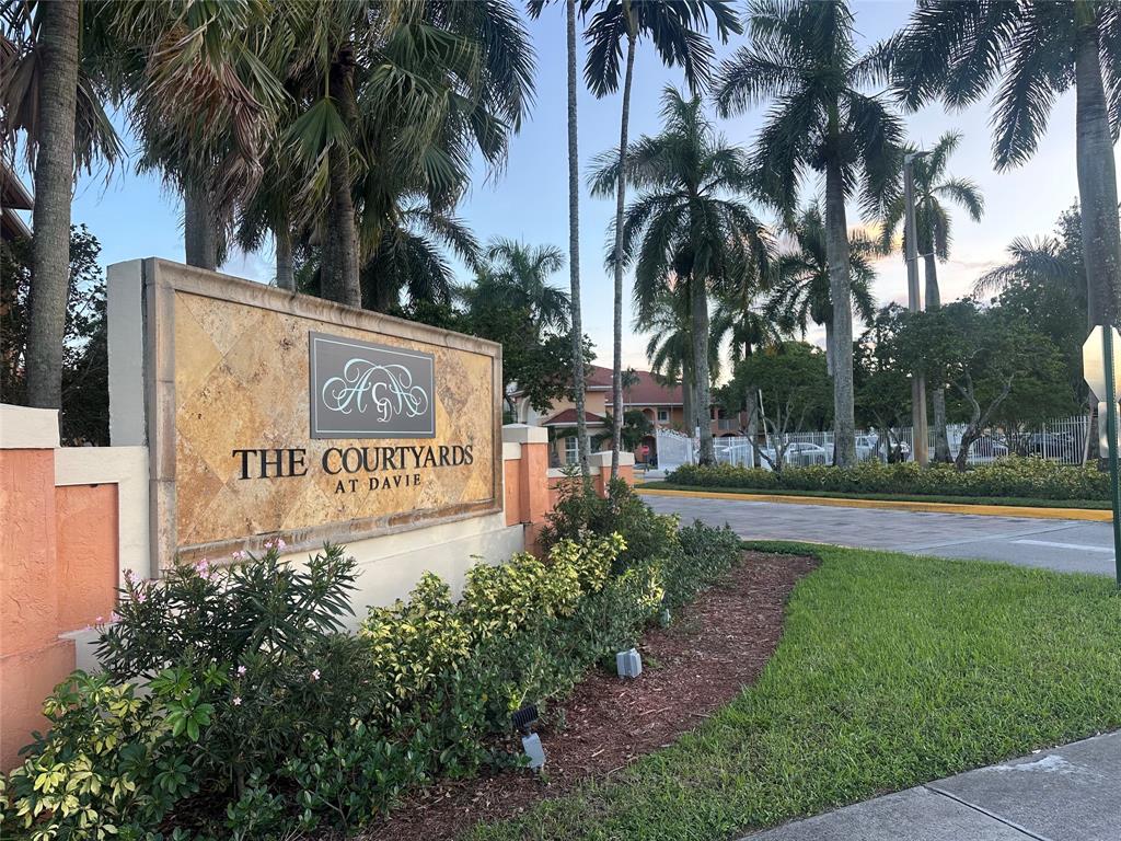 6928 Southwest 39th Street, Unit 207 Fort Lauderdale, FL 33314 - Photo 2 of 21 a sign on the side of the road