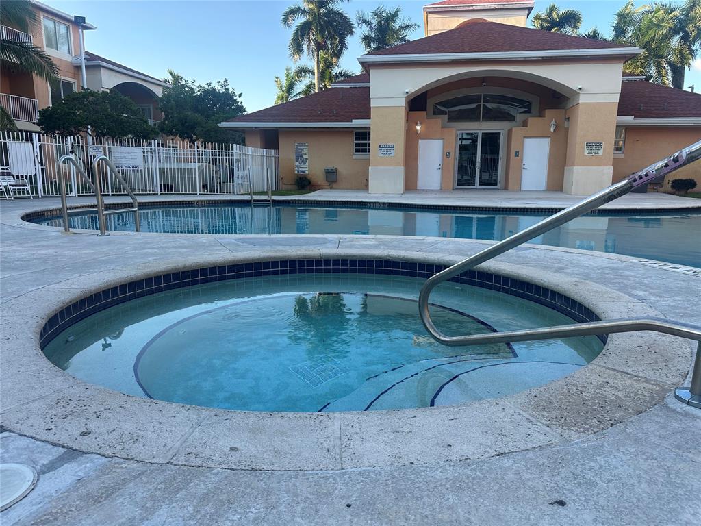 6928 Southwest 39th Street, Unit 207 Fort Lauderdale, FL 33314 - Photo 21 of 21 a view of a house with a wooden deck