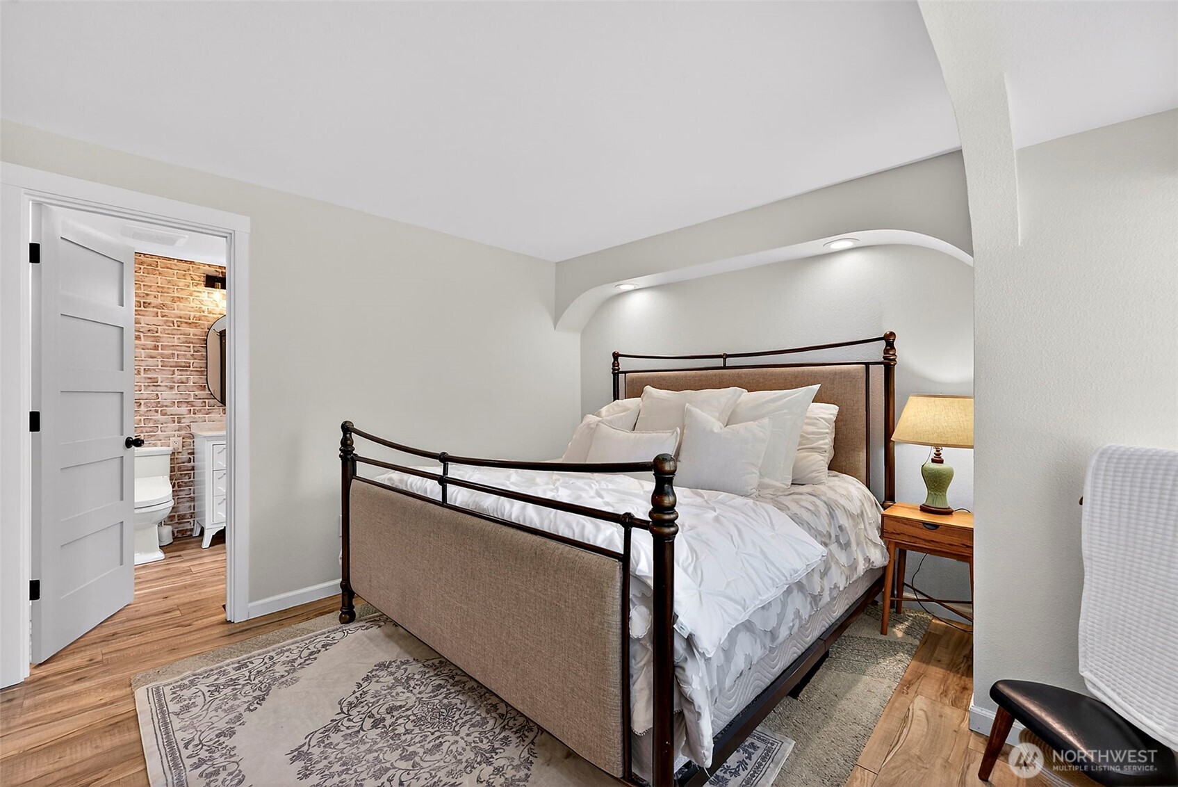 112 Lila Street Steilacoom, WA 98388 - Photo 13 of 37 a bedroom with a bed and wooden floor