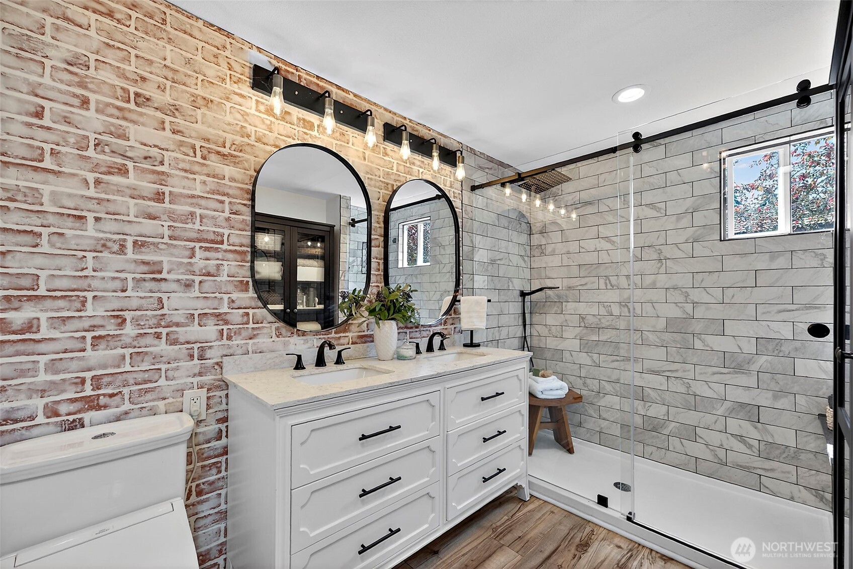 112 Lila Street Steilacoom, WA 98388 - Photo 14 of 37 a bathroom with a sink mirror and shower