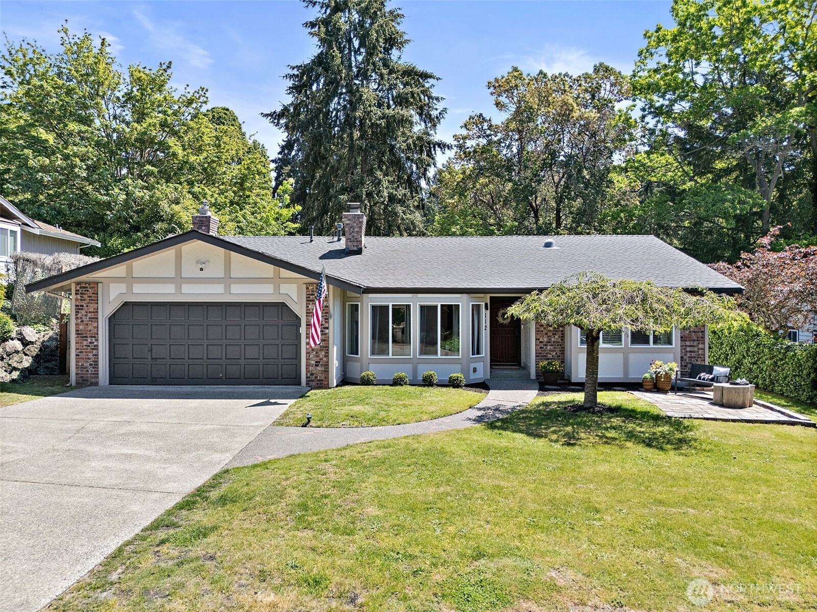 112 Lila Street Steilacoom, WA 98388 - Photo 33 of 37 a front view of a house with a yard garage and outdoor seating