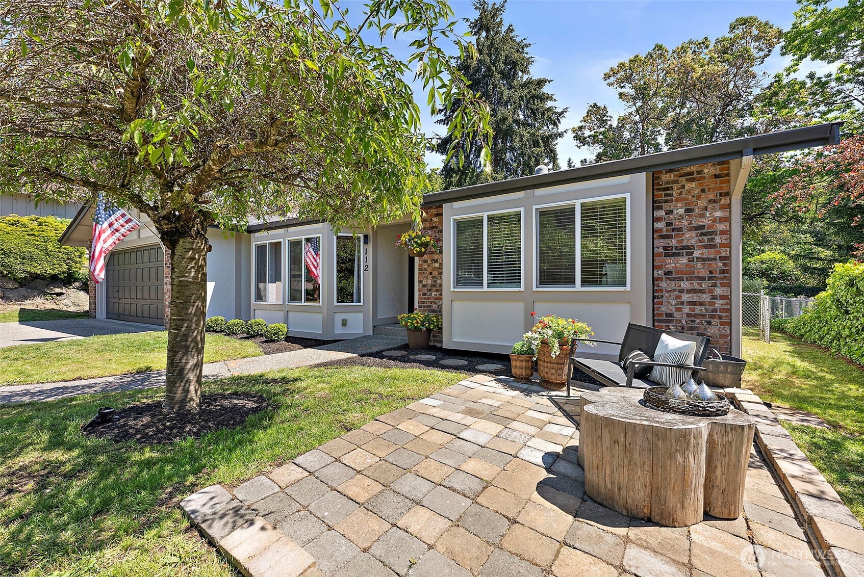 112 Lila Street Steilacoom, WA 98388 - Photo 34 of 37 a view of a house with backyard sitting area and garden