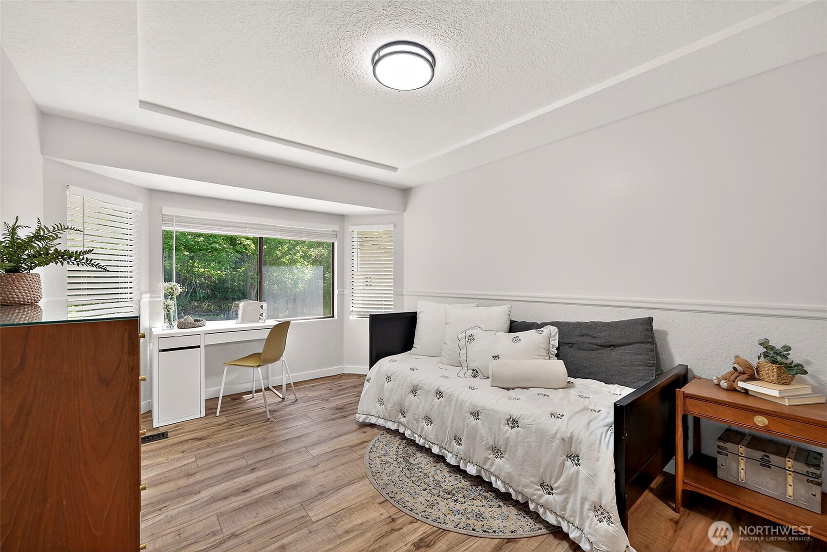 112 Lila Street Steilacoom, WA 98388 - Photo 10 of 37 a bedroom with a bed and wooden floor