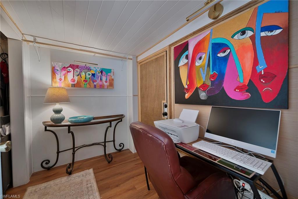 777 Walkerbilt Road, Unit 34 Naples, FL 34110 - Photo 11 of 22 a view of a room with furniture and screen