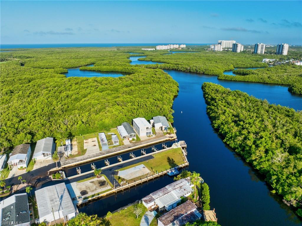 777 Walkerbilt Road, Unit 34 Naples, FL 34110 - Photo 20 of 22 a view of an ocean from a balcony