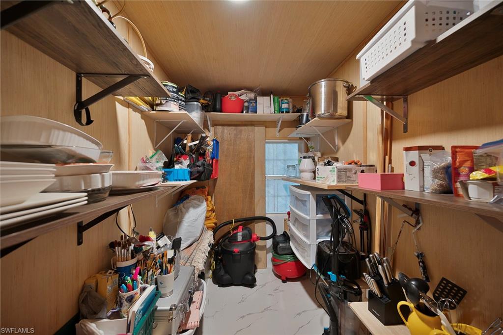 777 Walkerbilt Road, Unit 34 Naples, FL 34110 - Photo 10 of 22 a view of storage and utility room