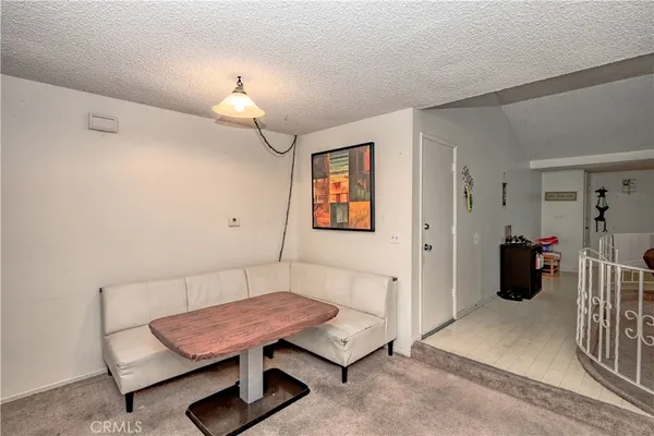 a bedroom with furniture and a chandelier