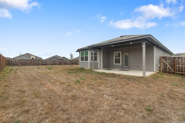 a house with trees in the background