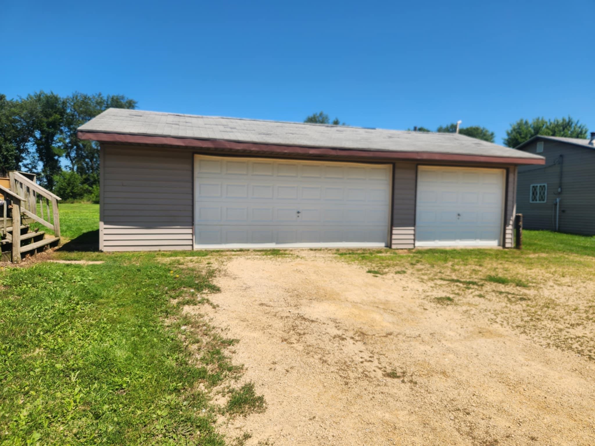 4592 West McConnell Road McConnell, IL 61050 - Photo 3 of 10 a front view of house with garage