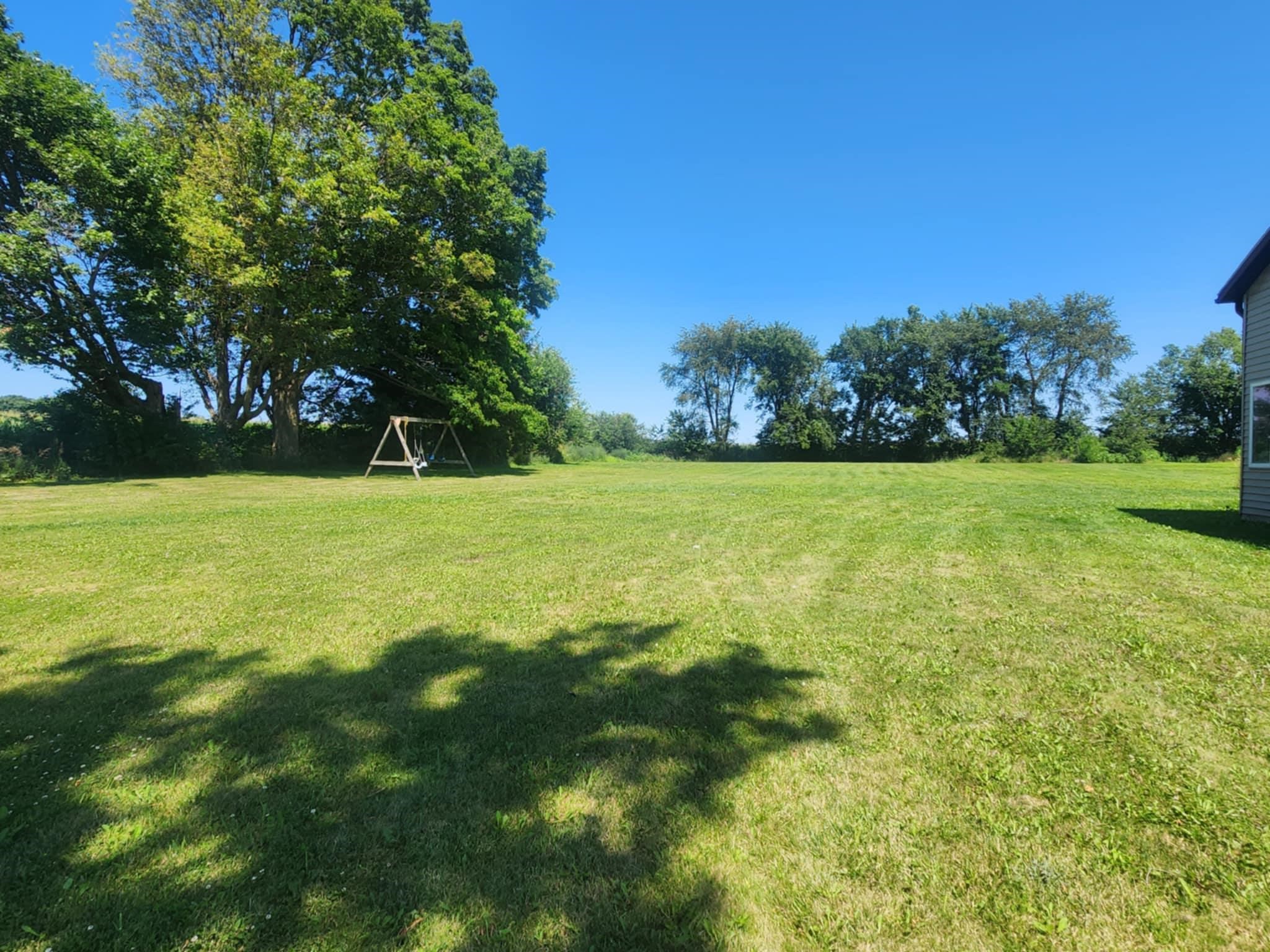 4592 West McConnell Road McConnell, IL 61050 - Photo 10 of 10 a view of a field with trees in the background